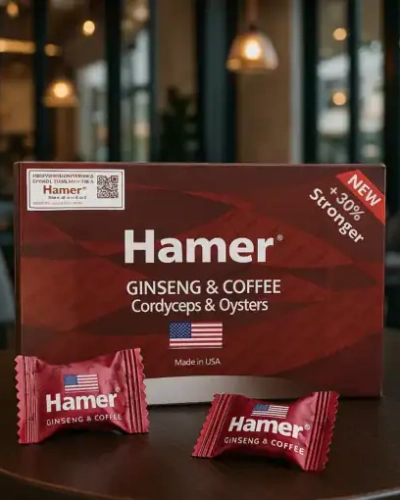 Kẹo sâm Hamer Đỏ Mỹ chính hãng – Hộp Hamer đỏ và hai viên kẹo trên bàn