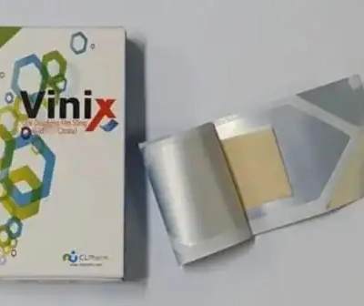 Tem ngậm Vinix 100mg Hàn Quốc chính hãng – hộp Vinix bên trái và một gói film mỏng mở ra bên phải
