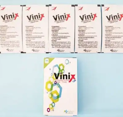 Tem ngậm Vinix 100mg Hàn Quốc chính hãng – năm gói lẻ Vinix xếp hàng và hộp Vinix trắng nền xanh nhạt