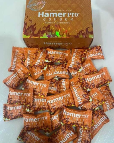 Kẹo sâm Hamer Pro Malaysia vị mật ong chính hãng – Hộp Hamer Pro cam và nhiều viên kẹo bày ra